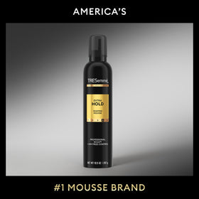 TRESemmé mousse being blow-dried at roots to create lasting lift benefit
