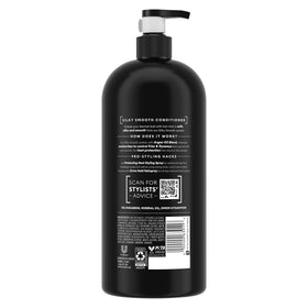 TRESemmé 39 oz bottle on bathroom shelf showing large, value size