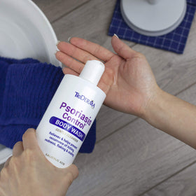 TriDerma in-shower use rinsing away flakes for smoother skin