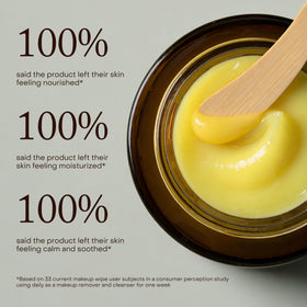 True Botanicals applying cleansing balm to face, helps dissolve makeup gently