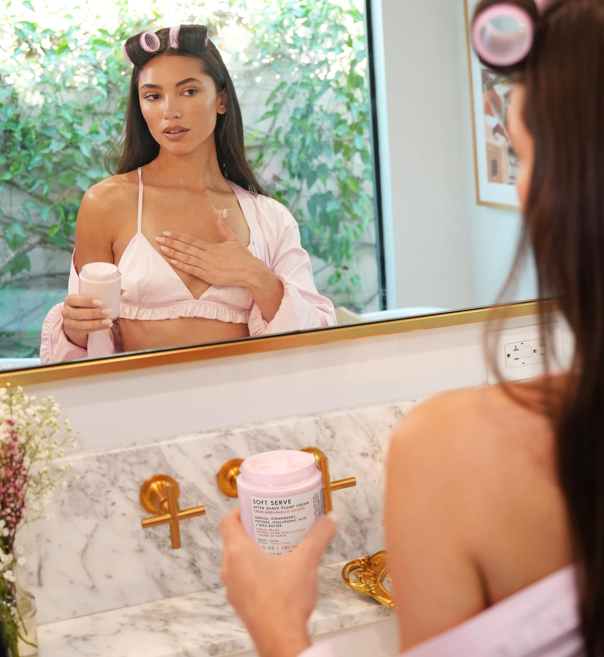 Truly being applied to leg to soothe post-shave skin and reduce bumps