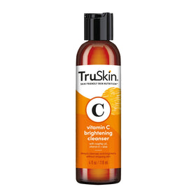 TruSkin lifestyle shot of woman washing face for daily routine