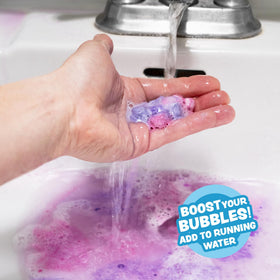 Open container filled with 90 Tub Works mini bath bombs ready to use