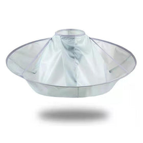 TUEQE lifestyle image with kid haircut showing comfort and mess control