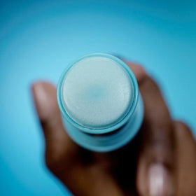TULA eye balm application on finger demonstrating easy, mess-free swipe