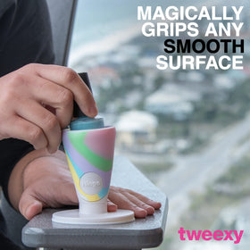 tweexy next to a hand for size comparison showing portable convenience