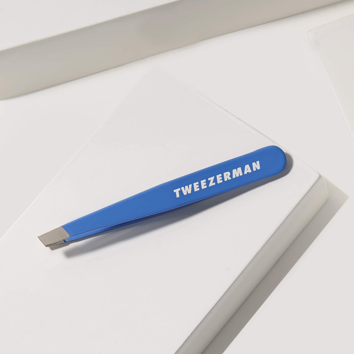 Tweezerman Bahama Blue held in hand showing size and ergonomic control