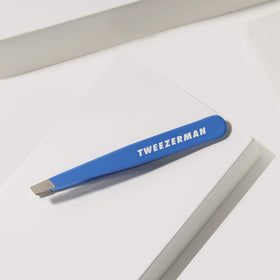 Tweezerman Bahama Blue held in hand showing size and ergonomic control