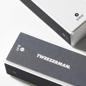 Tweezerman close-up of buffer sides texture showing labeled color-coded pads for control
