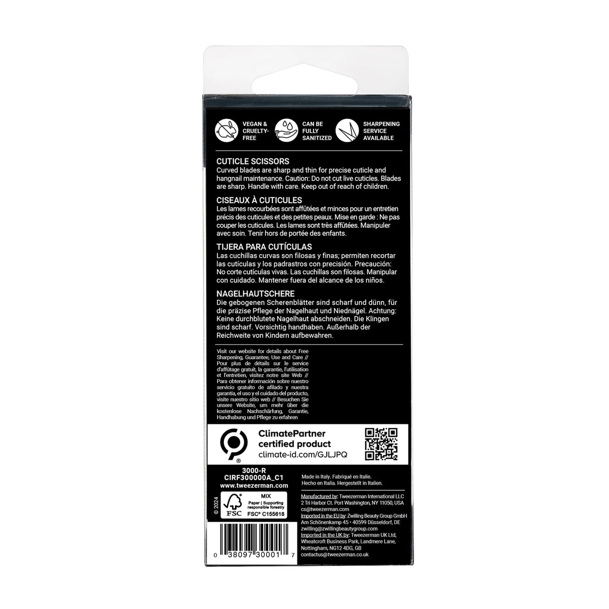 Tweezerman scissors beside manicure tools in lifestyle setting for neat at-home grooming