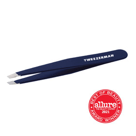 Tweezerman next to ruler showing size and scale for travel convenience