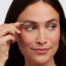 Tweezerman slant tweezer angled close-up displaying precise 25-degree tip advantage