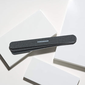Tweezerman file held in hand to show 7-inch scale and improved leverage