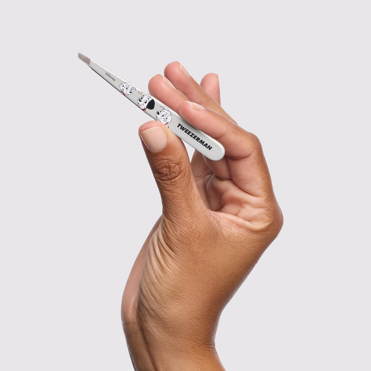 Tweezerman being used on eyebrow showing firm control and comfortable calibrated tension
