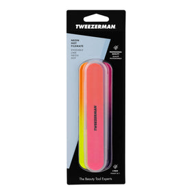Tweezerman Filemates in a beauty bag at a styling station for travel-ready grooming