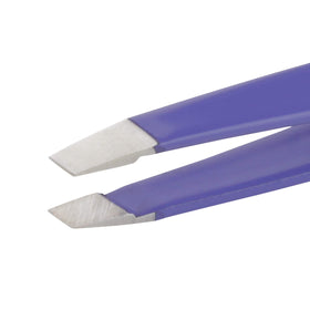 Tweezerman placed inside a toiletry bag showing on-the-go grooming benefit
