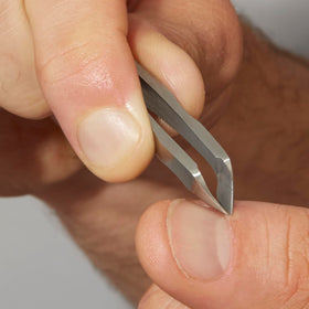 Tweezerman in a manicure kit representing portability and professional readiness