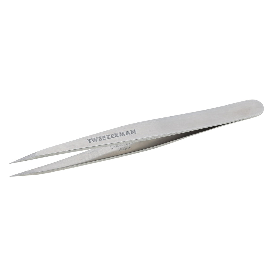Tweezerman point tweezer front view showing polished stainless steel and precise tips for accuracy