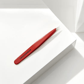 Tweezerman tweezer in use removing an ingrown hair for accurate grooming and less irritation