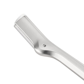 Tweezerman close-up of stainless steel blade illustrating sharp edge and smooth finish for gentle touch-ups