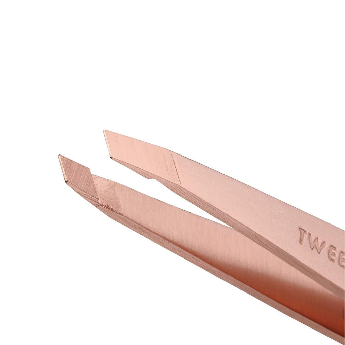 Tweezerman rose gold point tweezer close-up highlighting fine tip for precise ingrown-hair removal
