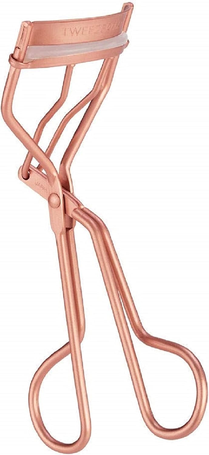 Tweezerman rose gold curler front view showing sleek frame and comfortable handles