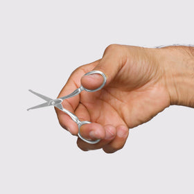 Tweezerman close-up of rounded tip blade detail highlighting safety and precise cutting