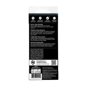 Tweezerman scissors beside a coin showing size and portability for travel convenience