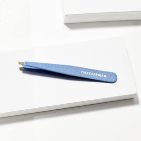 Tweezerman inside a makeup pouch showing travel-friendly size and quick-access convenience
