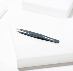 Tweezerman tweezer and alcohol wipe demonstrating simple tip cleaning for hygiene