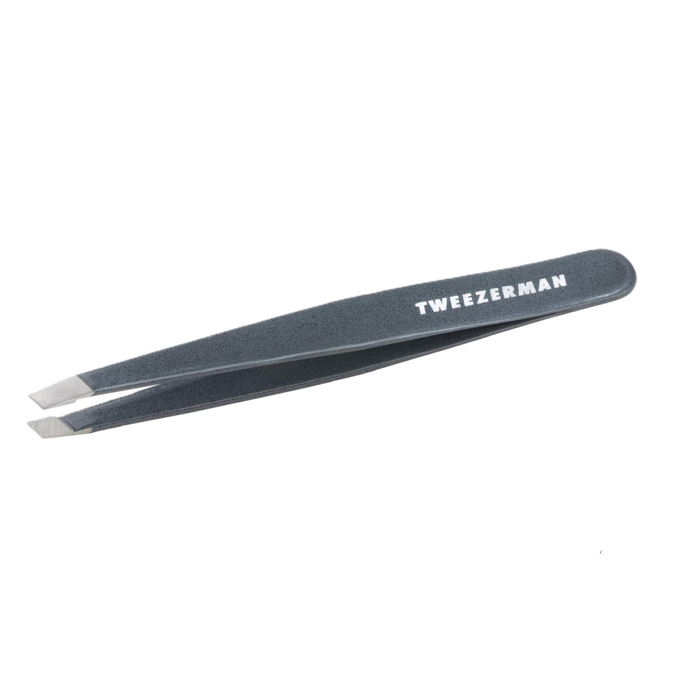 Tweezerman front view of blue stone slant tweezer showing polished finish and professional look