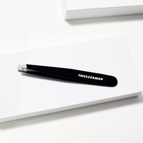 Tweezerman tweezer held in hand demonstrating comfortable grip and steady shaping benefit