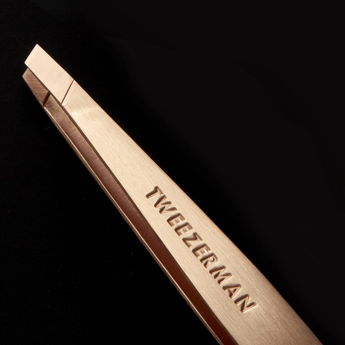 Tweezerman tweezer with packaging showing professional tool and travel-ready convenience