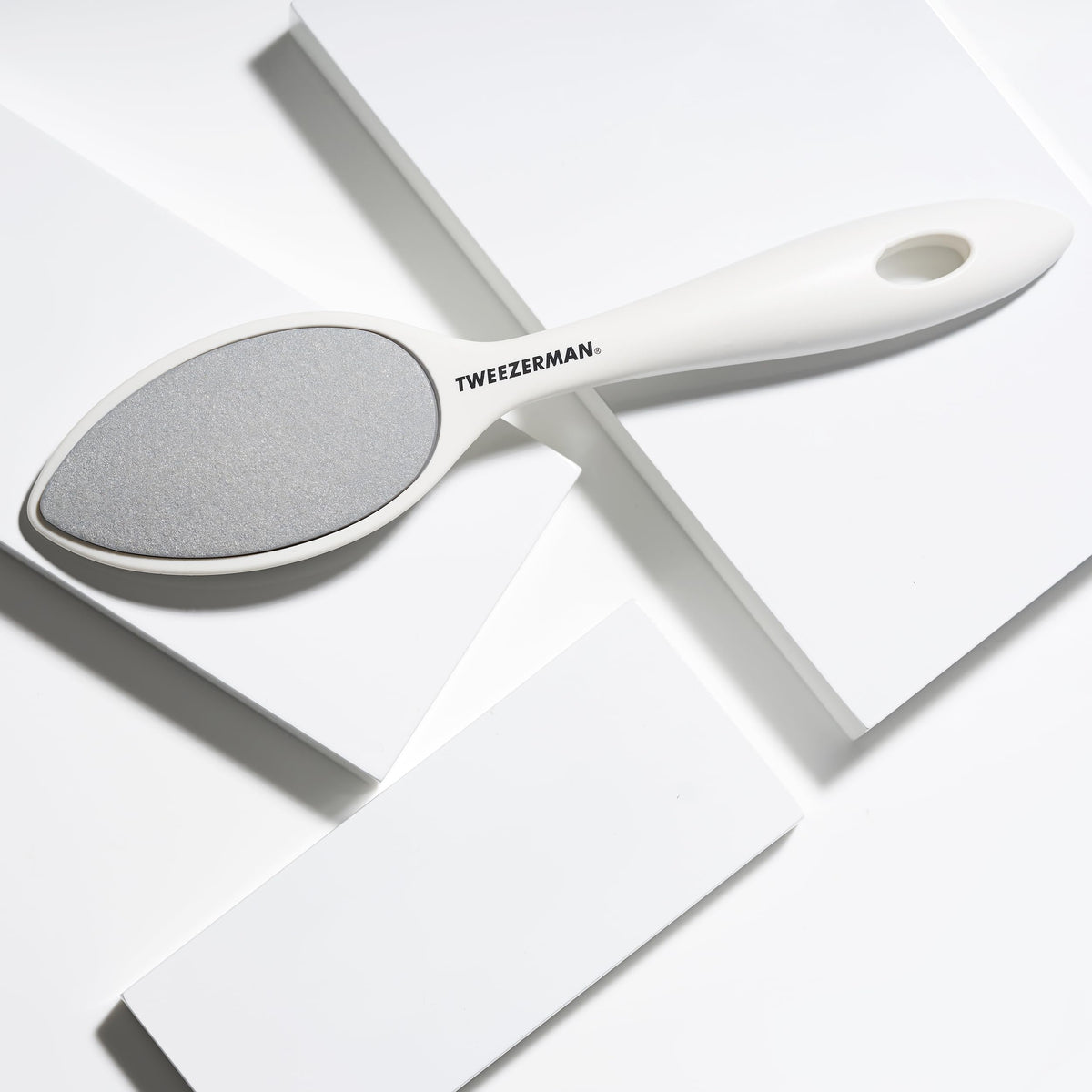 Tweezerman in-shower use illustrating waterproof design for convenient wet exfoliation