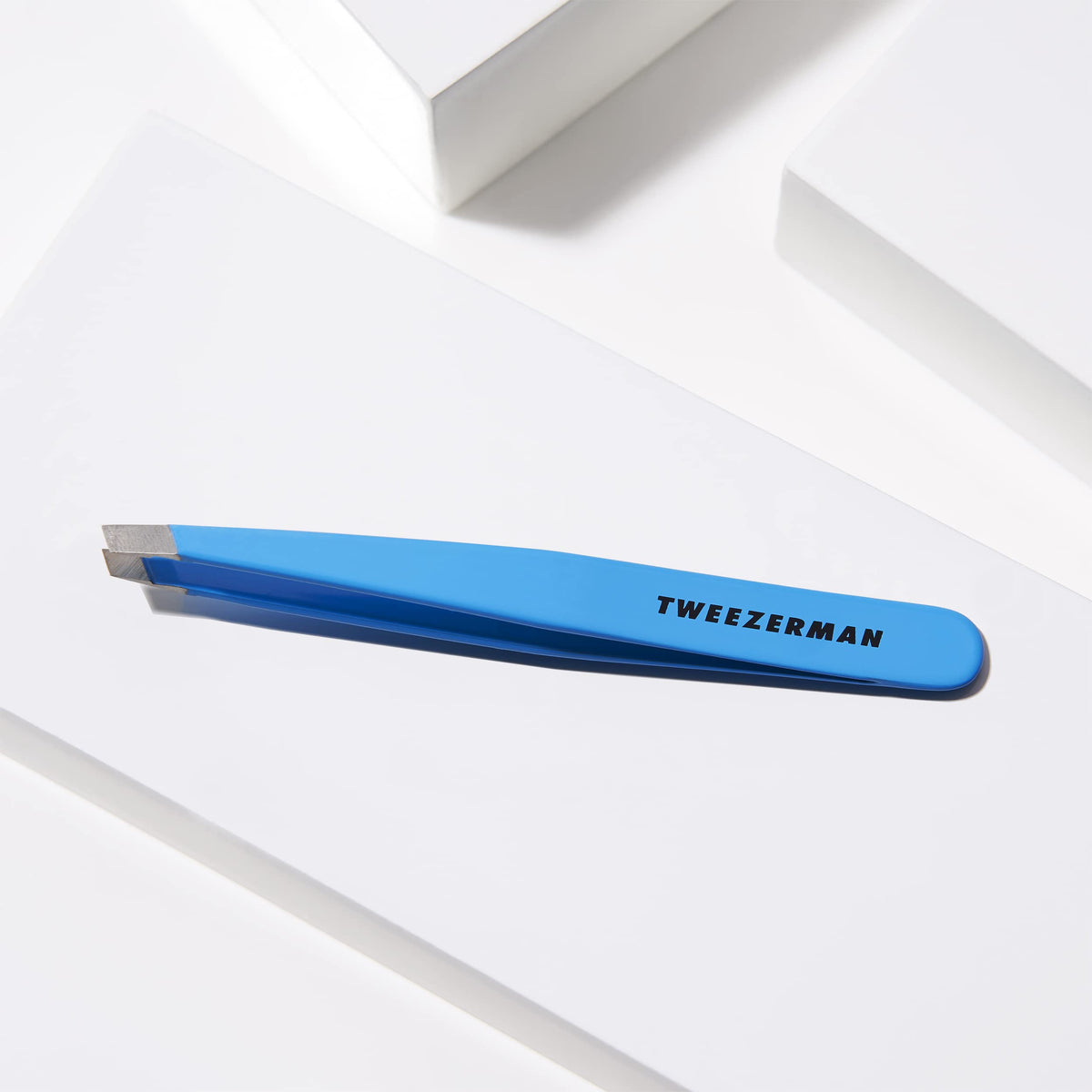 Tweezerman tips gripping hair during use for accurate, hassle-free removal