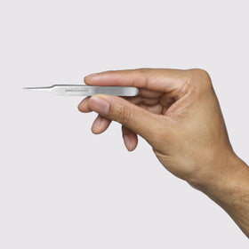 Tweezerman handle and calibrated tension visible for comfortable precise use