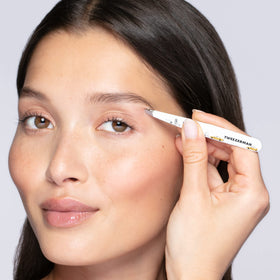 Tweezerman tweezer held in hand demonstrating ergonomic control and accuracy
