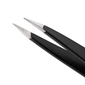 Tweezerman tweezer used to groom eyebrow in a bathroom setting for neat, salon-quality results