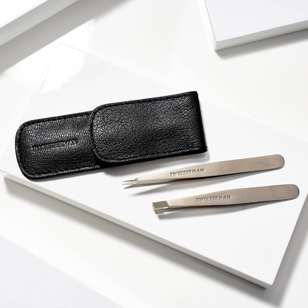 Tweezerman tweezer handle texture detail demonstrating grip design for steady control during use