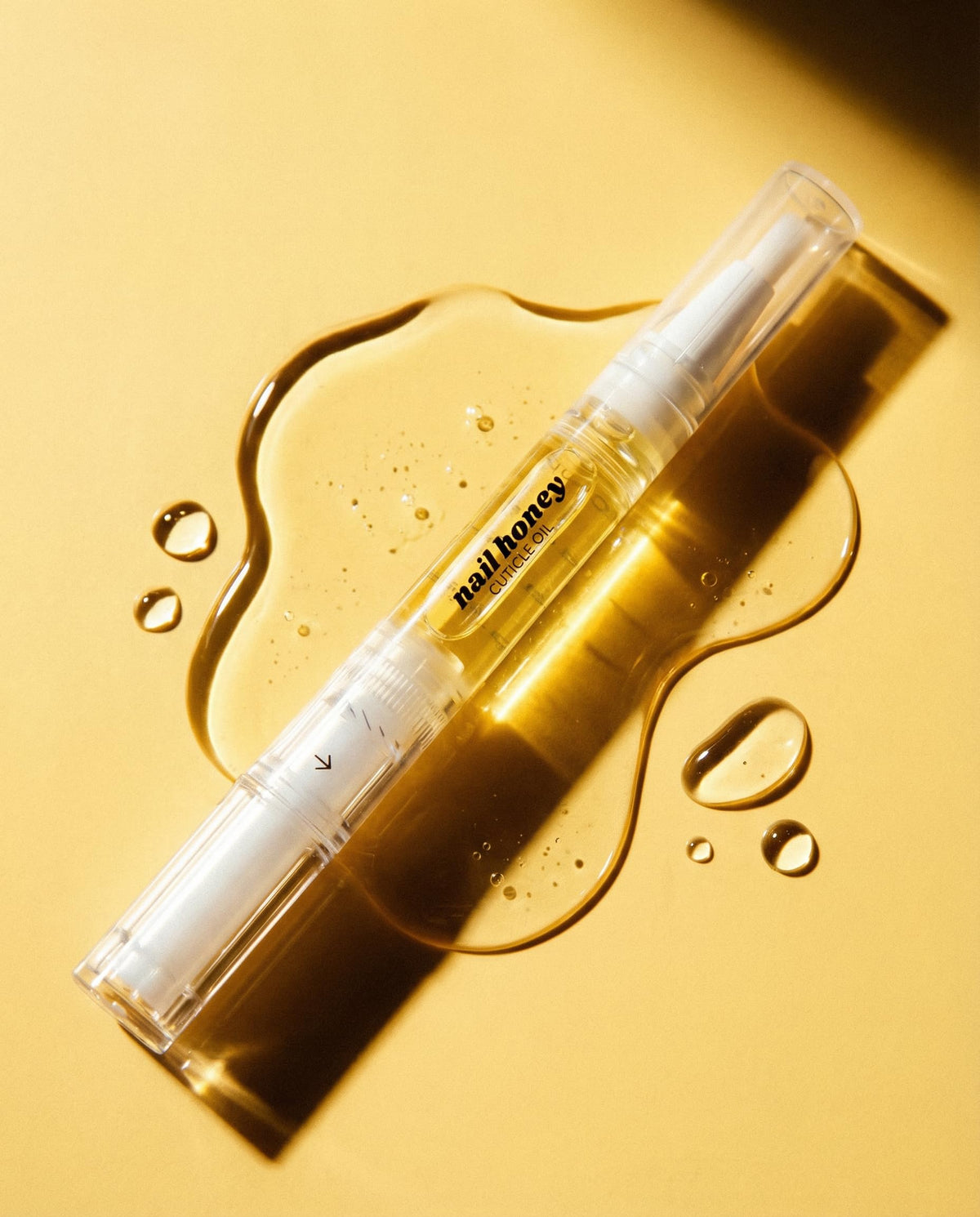 Twinkled T pen inside purse for on-the-go cuticle maintenance benefit
