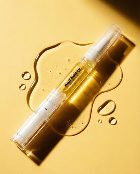 Twinkled T pen inside purse for on-the-go cuticle maintenance benefit