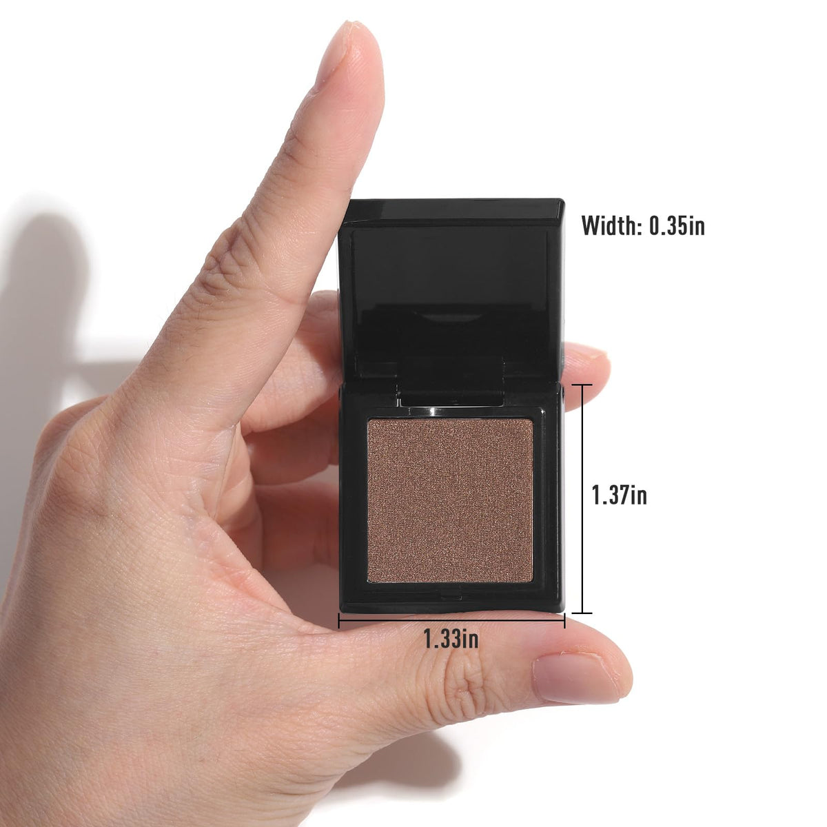 UCANBE compact palette held in hand showing travel-ready size and secure closure for portability