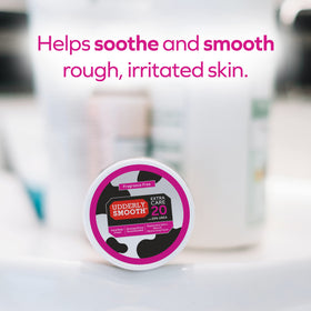 Udderly Smooth next to ruler to illustrate 8 oz size practical use
