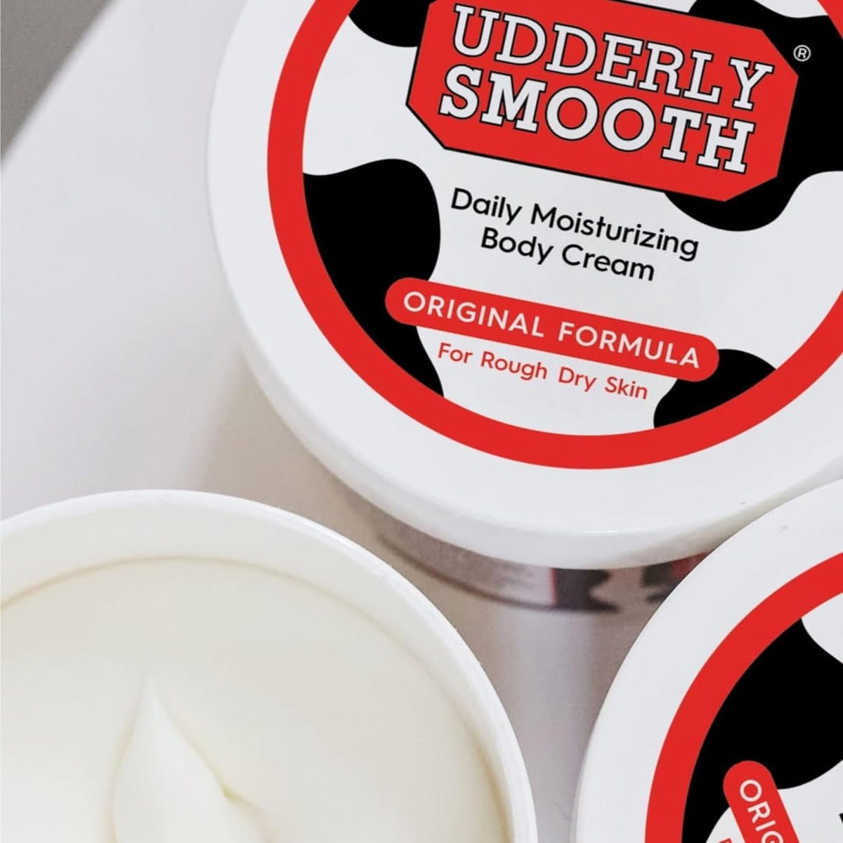 UDDERLY SMOOTH two jars stacked illustrating easy storage and supply
