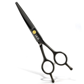 ULG scissors in gift-ready box on a table suggesting presentable packaging benefit