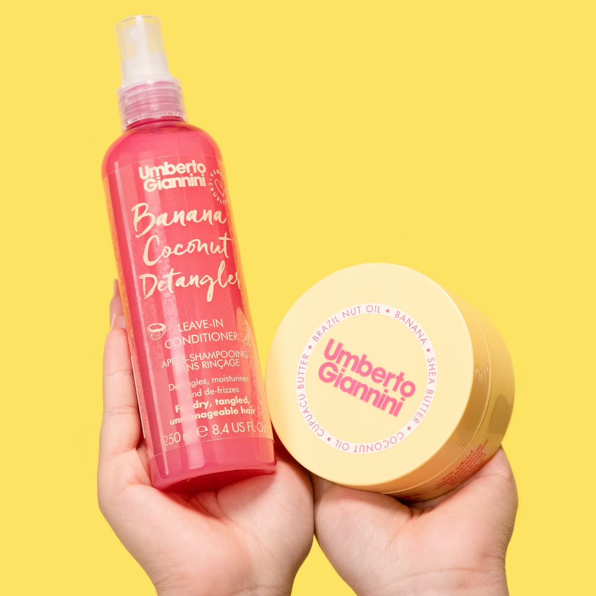 Umberto Giannini bottle held in hand to show 8.4 fl oz scale benefit