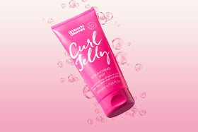 Umberto Giannini styled curls in sunlight showing shine and reduced frizz