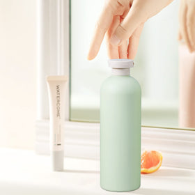 UMETASS bottles on bathroom counter illustrating refillable, eco-friendly storage