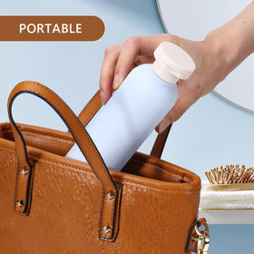 UMETASS bottle next to a passport and toiletry items showing true 8.8oz size for packing benefit