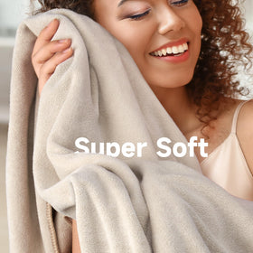 Umisleep towel next to standard bath towel comparing compact, lightweight design